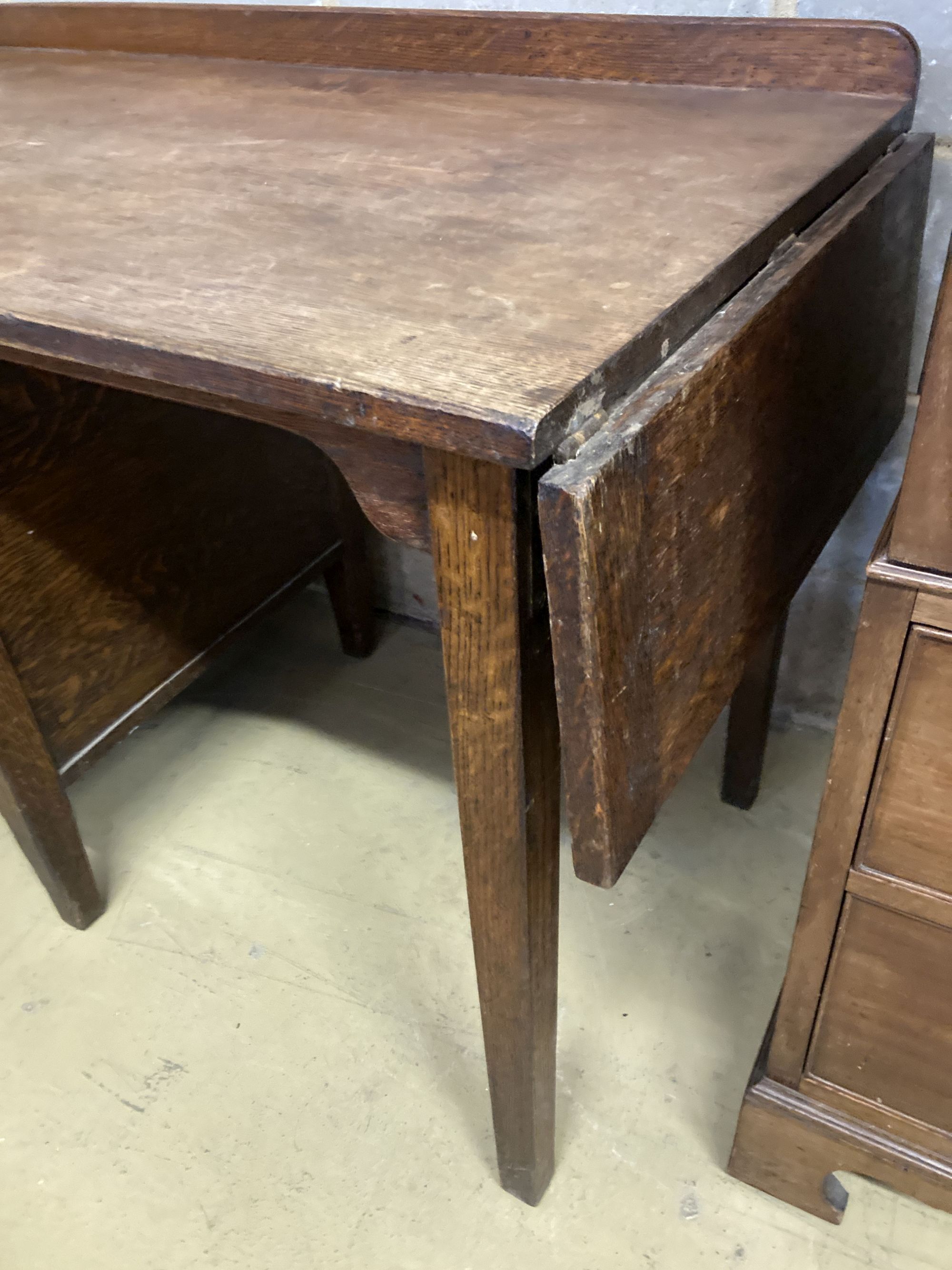 An early 20th century oak five drawer drop flap kneehole desk, width 108cm, depth 60cm, height 78cm